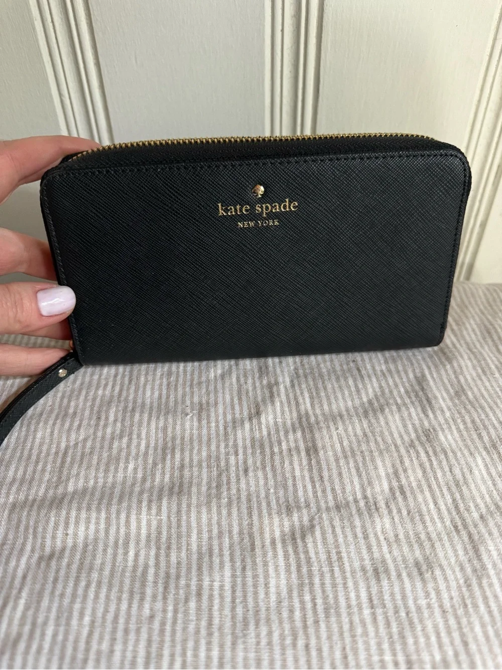 kate spade black zip-around wristlet wallet with gold logo